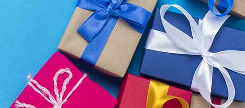 A lot of gift boxes on a blue background. Holiday concept, New Year, Christmas, Birthday, Valentine's Day. Copy space. Flat lay, top view