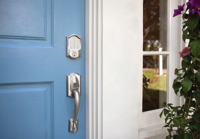 Schlage Encode wifi smart lock on blue front door.