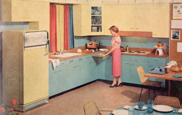 1950s kitchen with blue cabinets and yellow appliances.