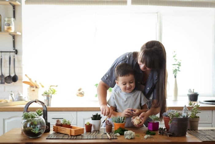 Mother and child building a terrarium.