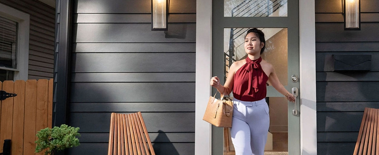 Stylish woman leaving her home.