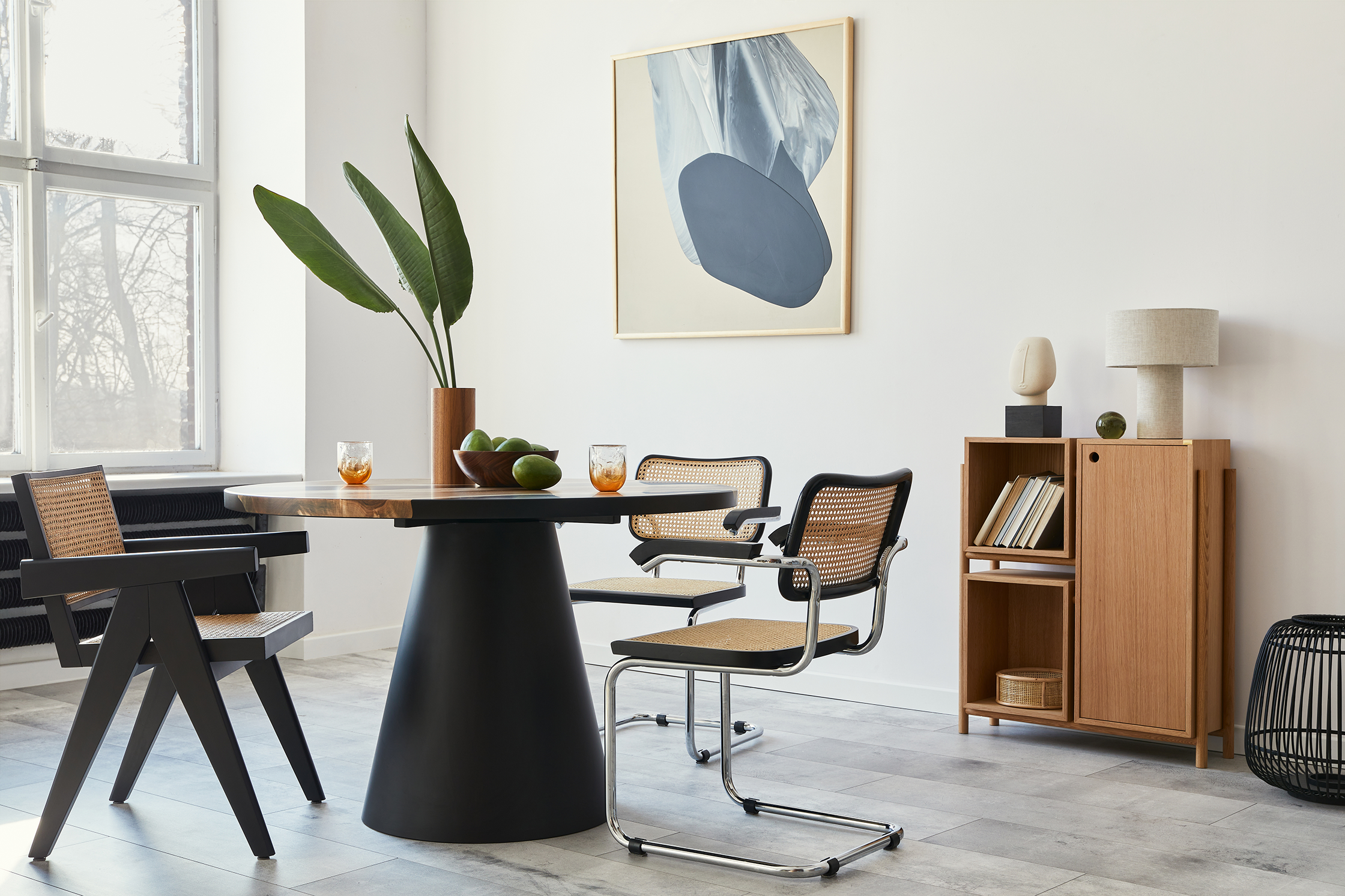 Modern dining room with abstract wall art.