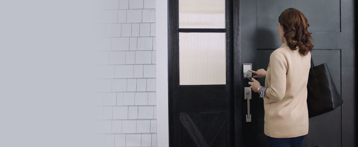 Airbnb guest entering code on a smart lock