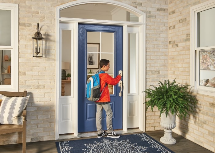 Kid unlocking Schlage Encode wifi smart lock.