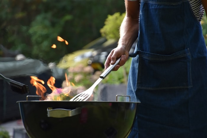 Man grilling for backyard party