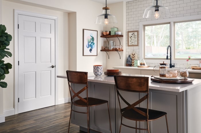 Kitchen with open shelving and Schlage Custom Door Hardware