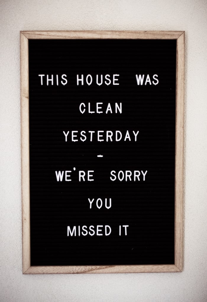 Letterboard with clean house quote.