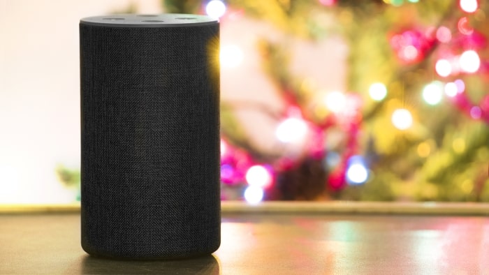 Amazon Echo speaker by Christmas tree.