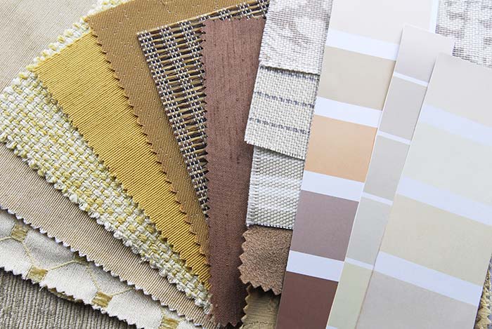 Natural tone paint and fabric swatches.