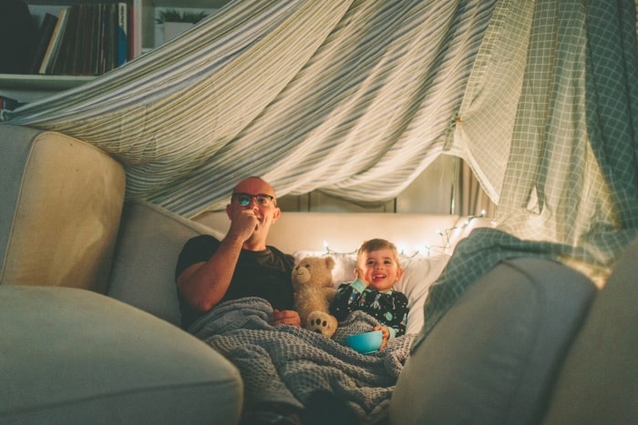 Father and son having family movie night.