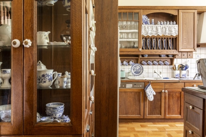 Old fashioned kitchen with wooden cabinets.