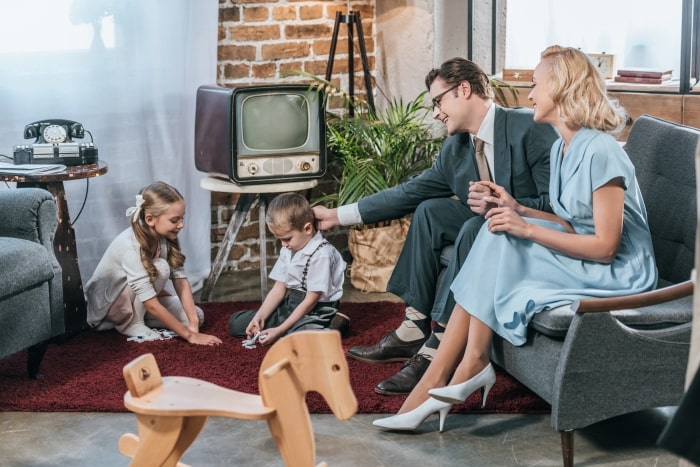 1950s family sitting in the living room.