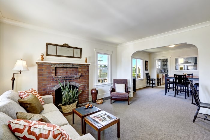 Open living and dining room space in older home.