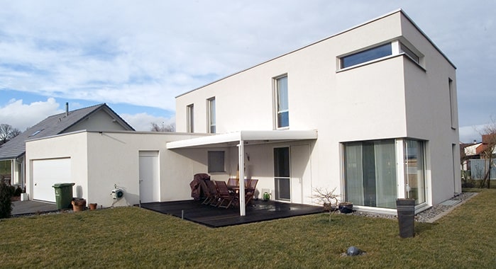 White flat roof home.