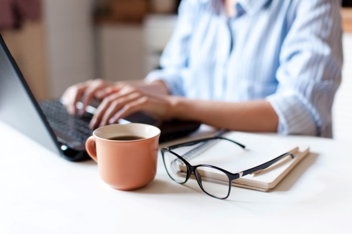 Woman using laptop.