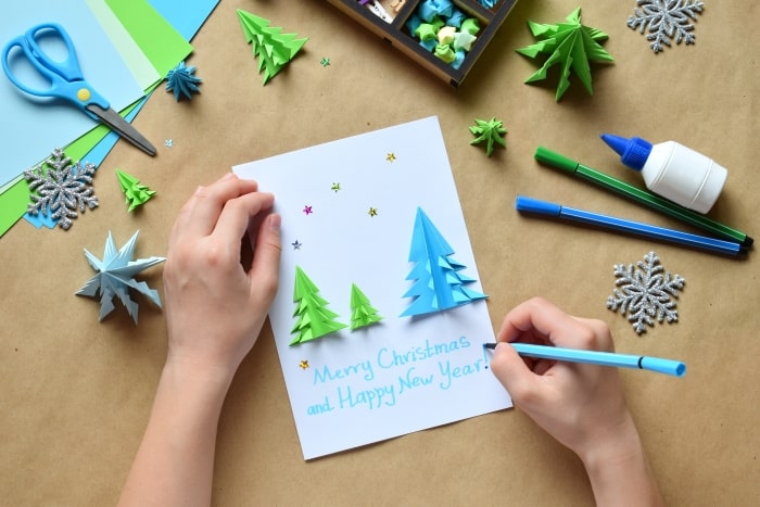 DIY Christmas card with origami trees.