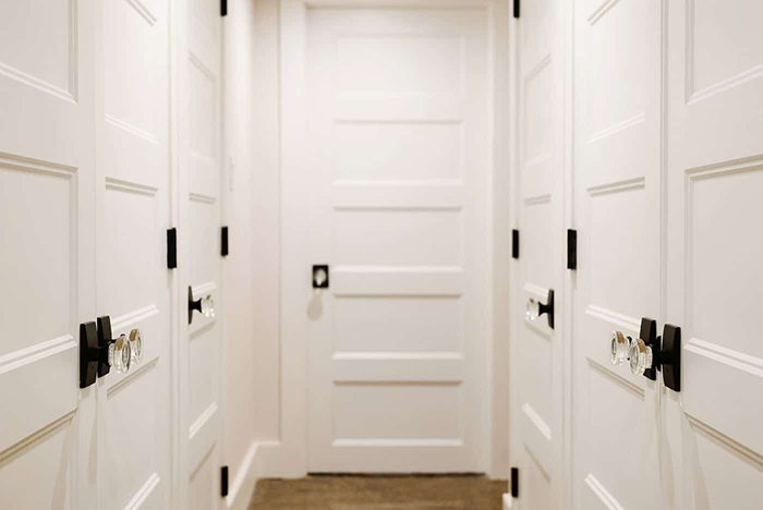 Yellow Brick Home hallway remodel with Schlage glass door knobs.