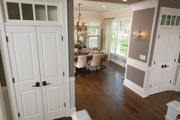 Dining room with double closet doors and Schlage levers.