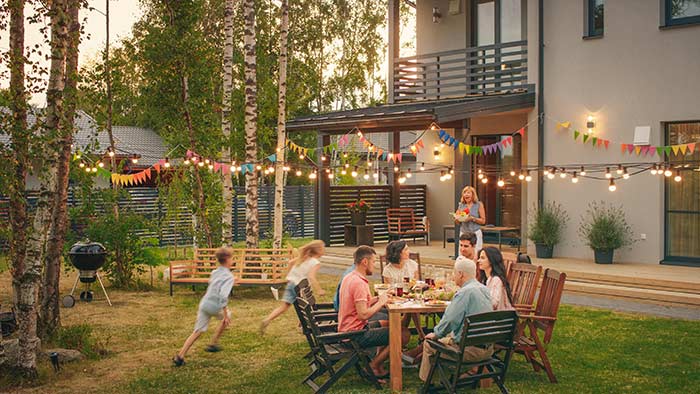 Family dinner party in backyard.