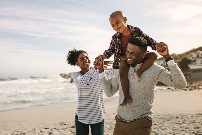 Family enjoying the beach while on vacation.