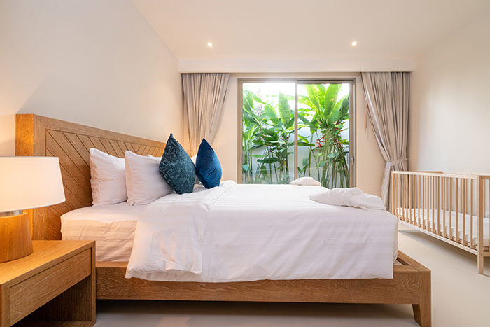 Guest room with baby crib.