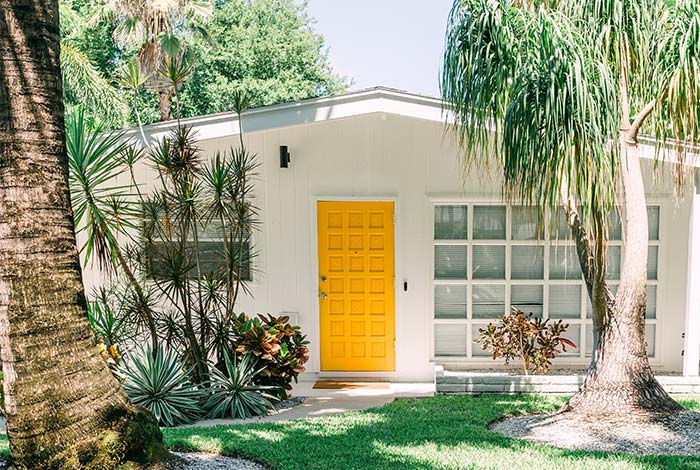 Mid-Century modern California home with yellow front door.