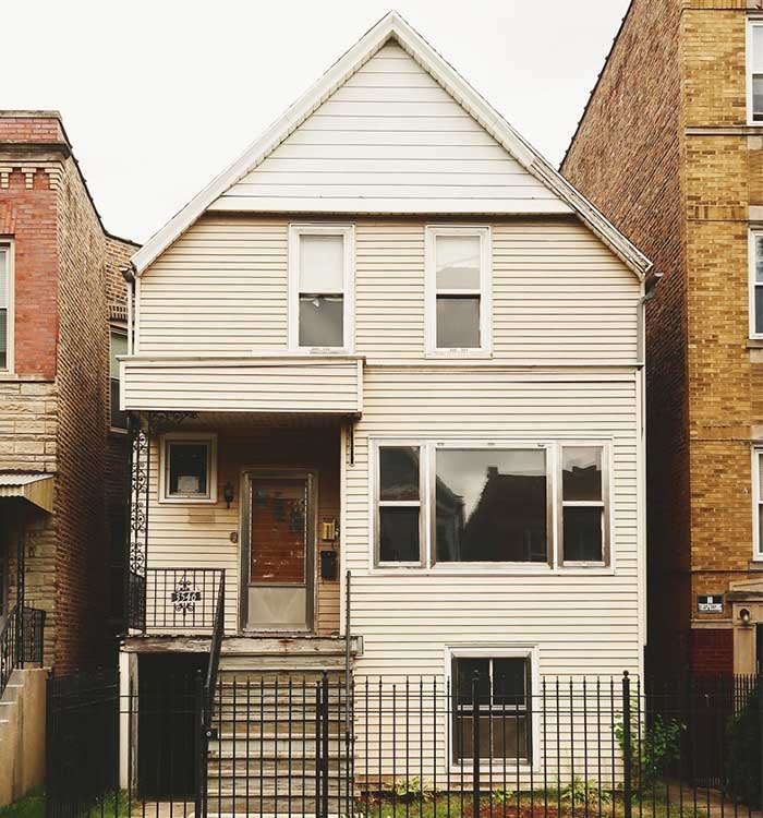 Yellow Brick Home Two Flat porch remodel before.