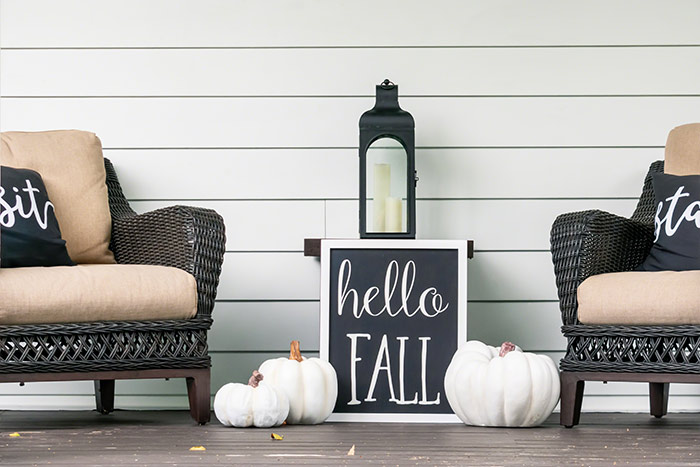 a cozy blanket, leaf pillow and fireplace for fall - Funky Junk Interiors
