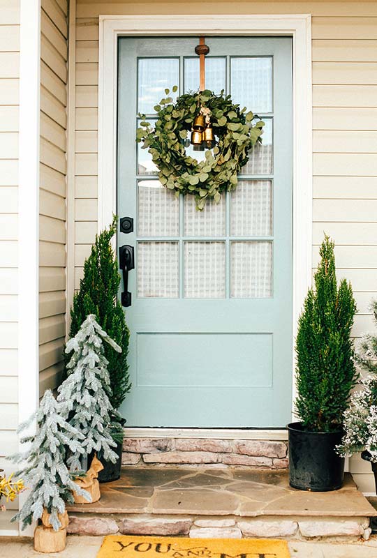 Front door makeover with simple holiday front porch decor.