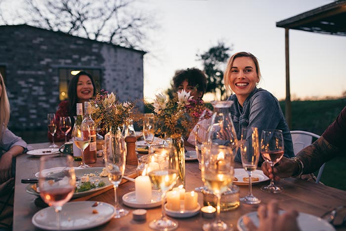 Women enjoying outdoor dinner party