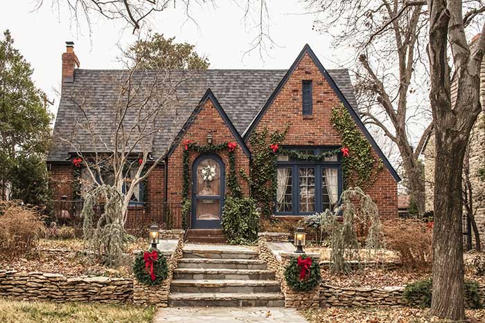 Brick cottage home decorated for Christmas.