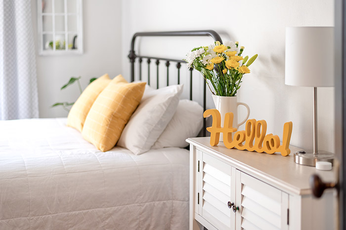Bedroom with yellow hello sign
