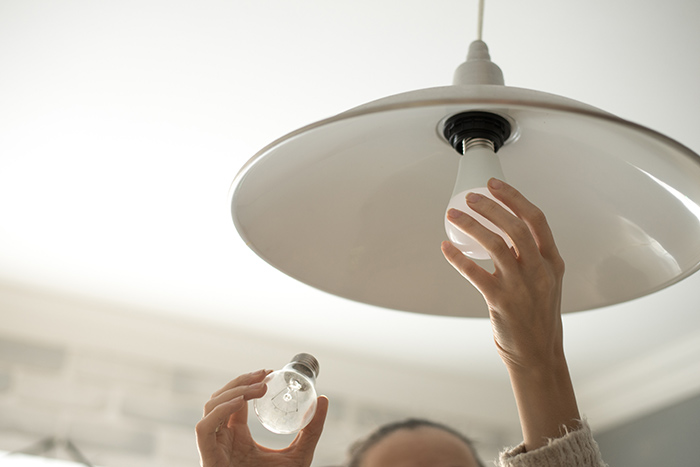 Changing lightbulb in pendant light.