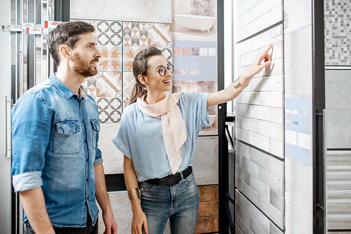 Couple choosing materials for home renovation.