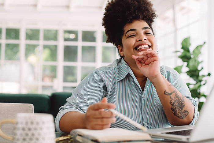 Woman smiling from home office