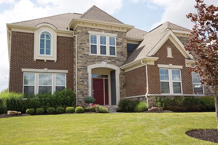 Suburban brick and stone home.