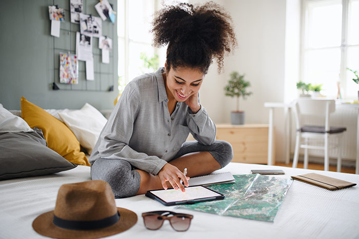 Woman planning summer vacation.