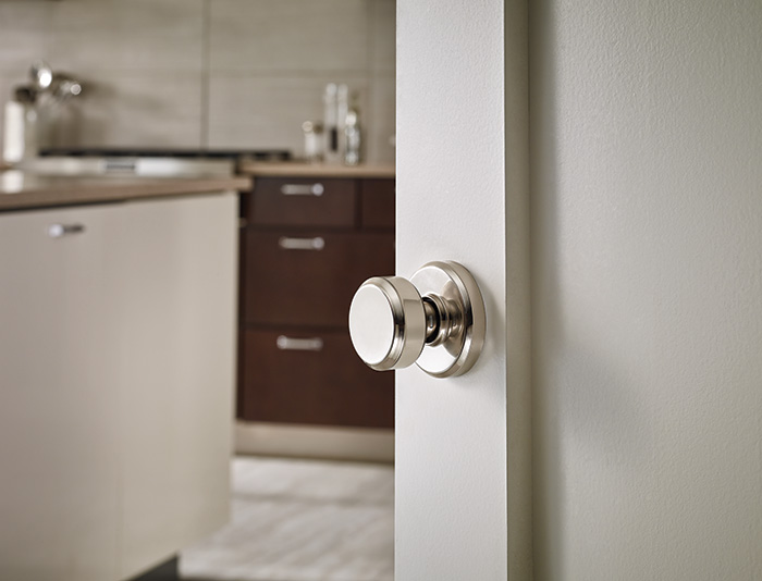 Polished nickel kitchen door knob.