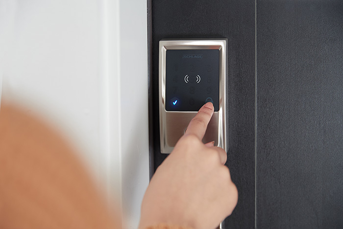Schlage Encode Plus WiFi Smart Deadbolt being unlocked at the touchscreen.
