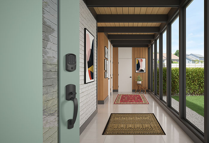 Mid-Century Modern smart home entryway with Schlage smart lock on front door.