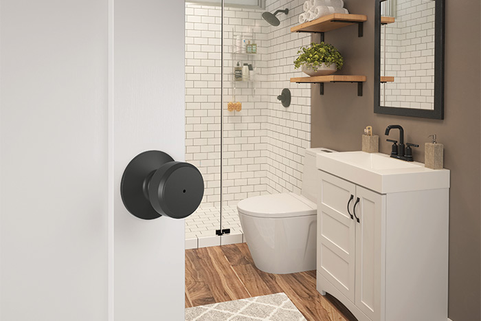 Updated farmhouse bathroom with matte black finishes and hardware.