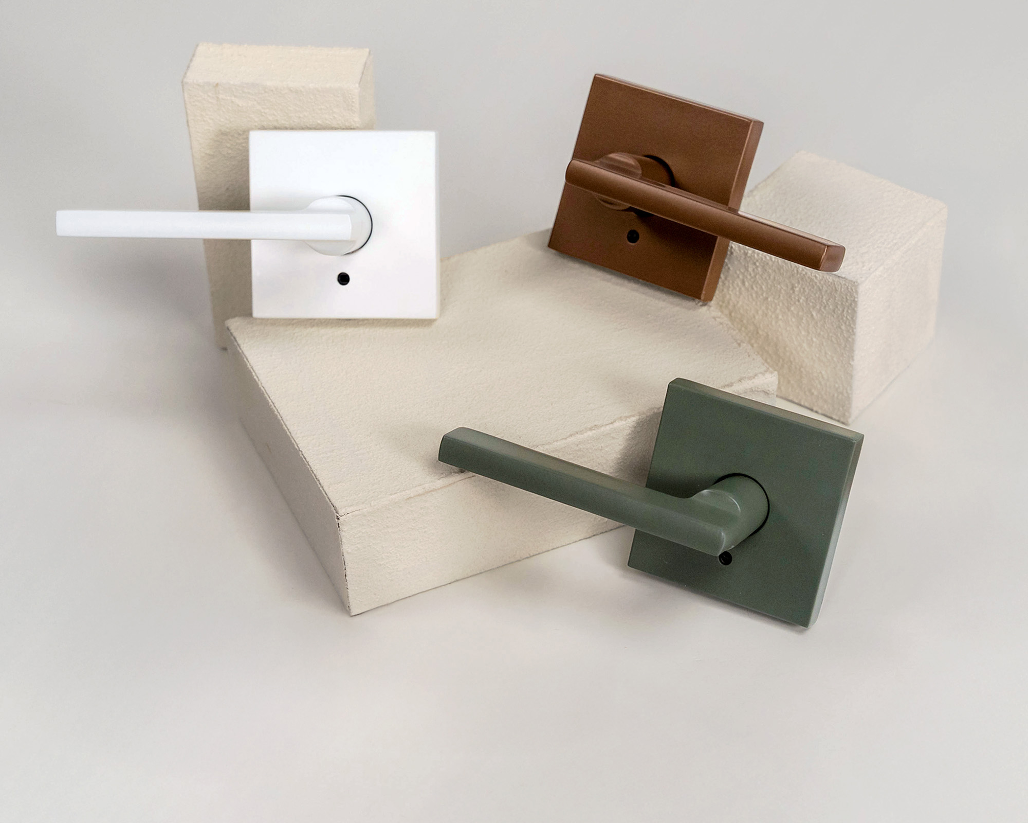 copper, green, and white custom door levers