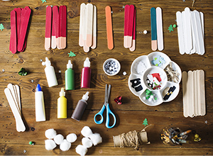 Art supplies spread across table.