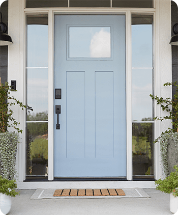 Light blue Craftsman style front door with matte black smart lock.