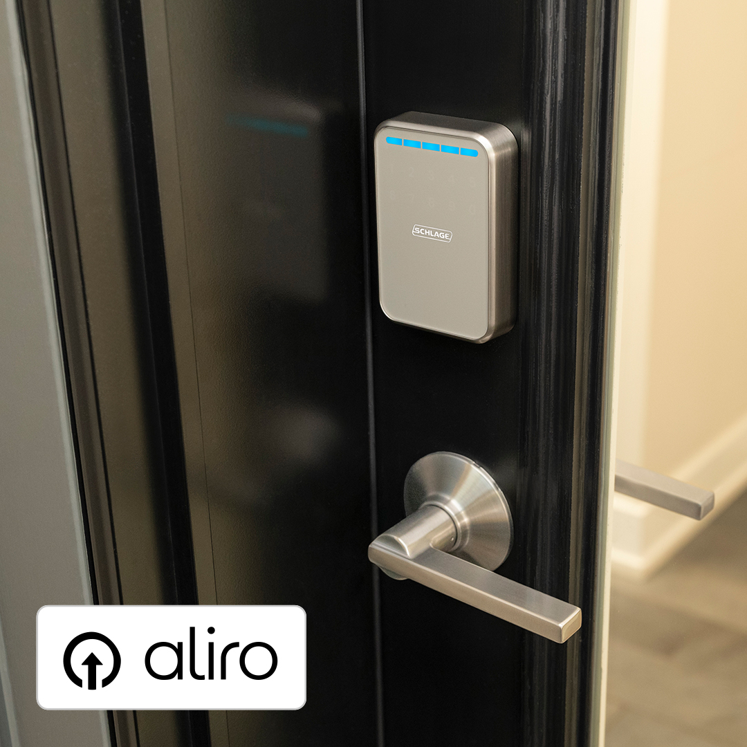 Schlage Sense Pro UWB smart lock on black door with aliro badge