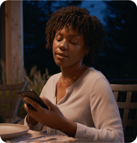 a lady sitting and using mobile