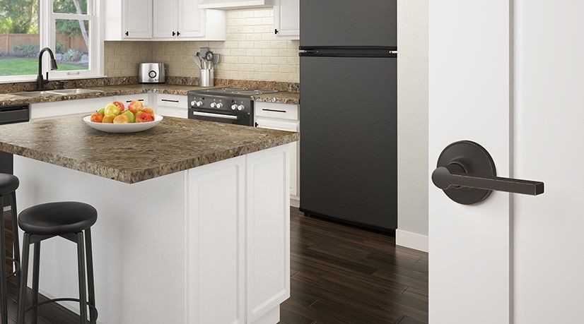 Schlage kitchen door lever in aged bronze available at Menards.