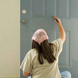 woman painting door | Schlage
