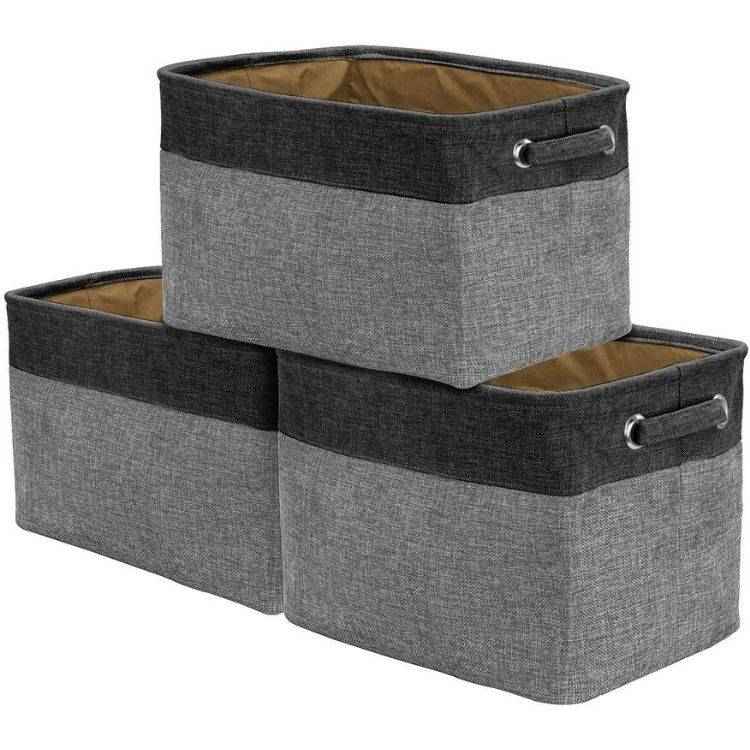 Decorative dark grey fabric storage baskets.