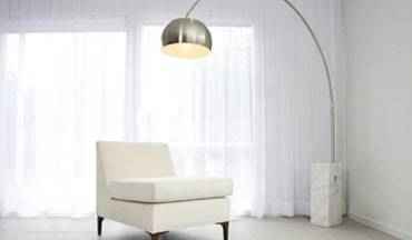 1960s style white chair with floor lamp.